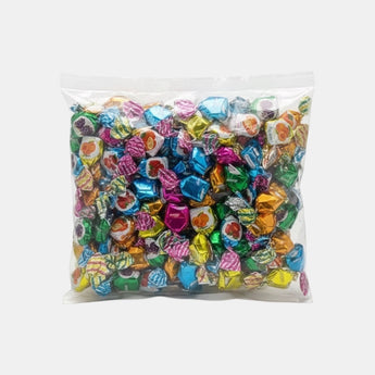 Bonbons fourrés goût fruits Olympic Hermes de Galeries d'Orient, emballés individuellement dans des papiers brillants multicolores.