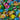 Bonbons fourrés Olympic Hermes aux goûts de fruits, emballages brillants multicolores, avec images de cerises, mûres, pêches et agrumes.
