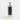Galeries d'Orient Rêve d’or Eau de Cologne vaporisateur en verre transparent avec liquide doré, étiquette bleue et dorée.